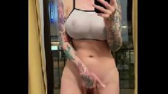 Bald slut squirting orgasm on the mirror with tattoos and glasses